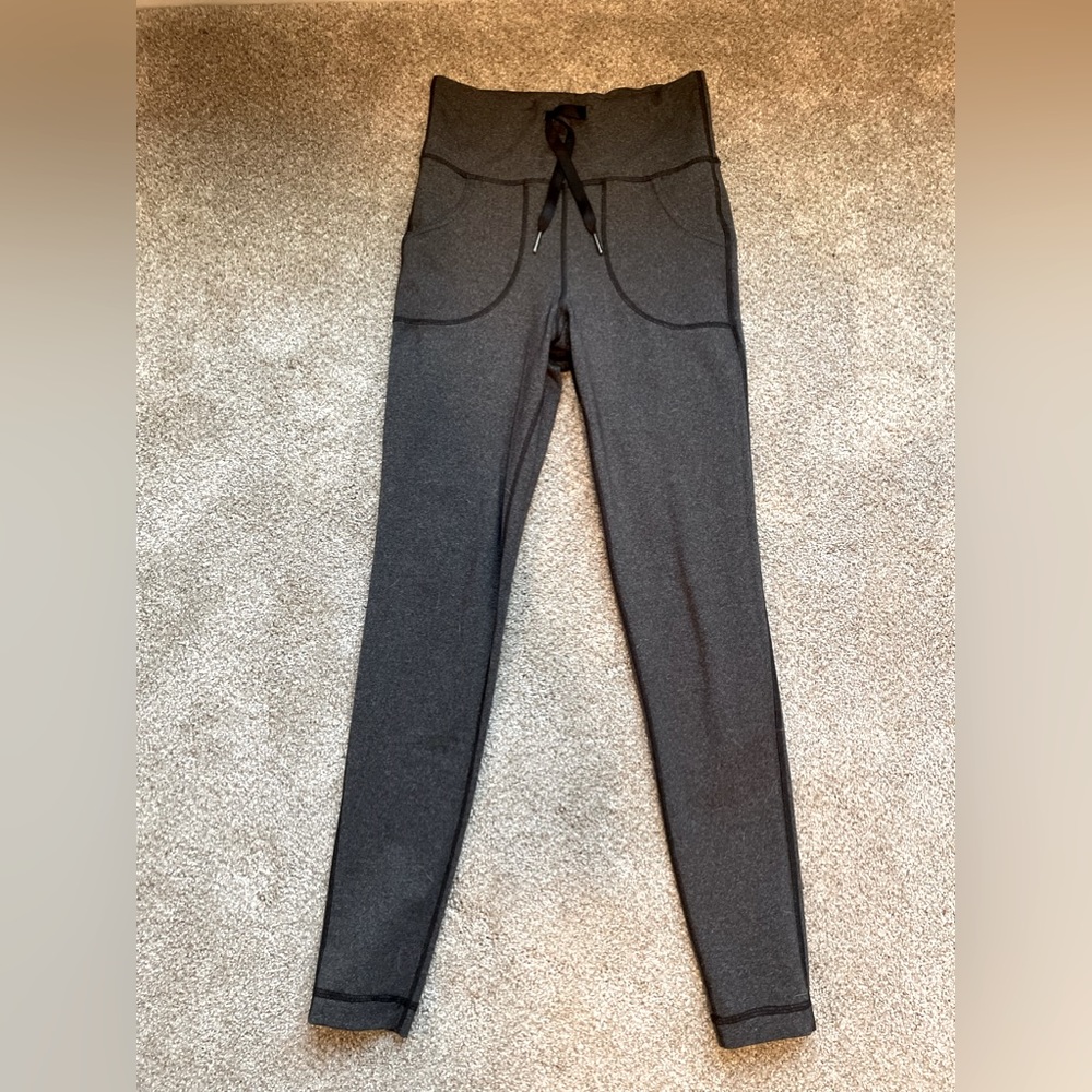 High rise Gray Lululemon leggings with pockets! Size 4, with string ties.